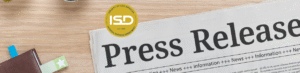 Newspaper with ISD logo and Press release title.